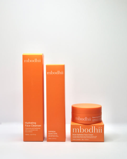 The boxed versions of the mbodhii Hydra Glow Essentials Pack in their boxes on a white background