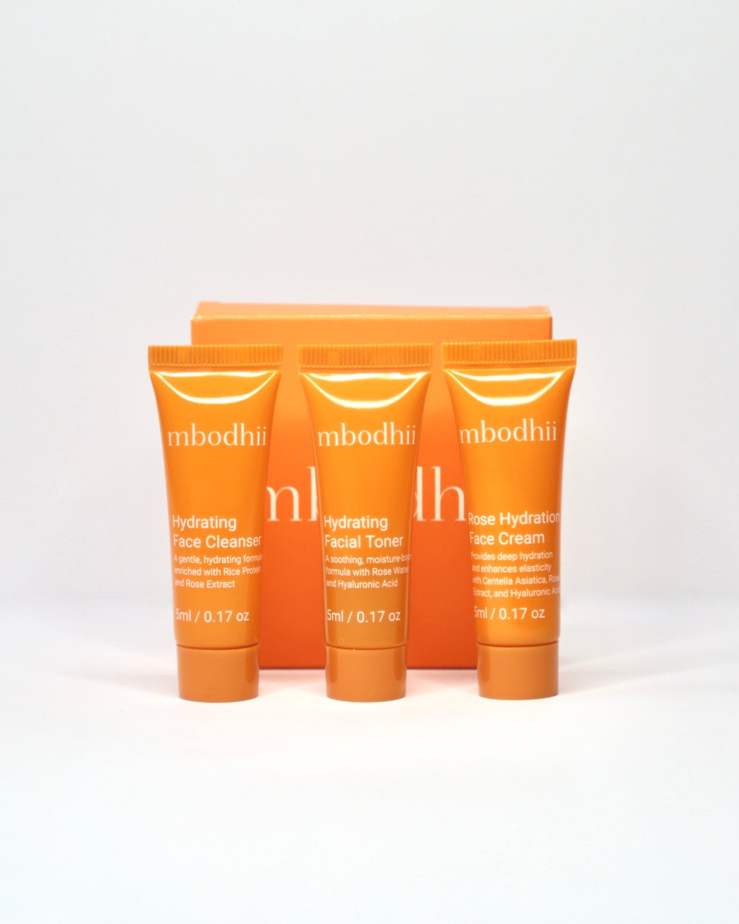 The mbodhii mini skincare sample pack of 3 x 5ml tubes of the Hydrating Face Cleanser + Hydrating Facial Toner + Rose Hydration Face Cream on a white background