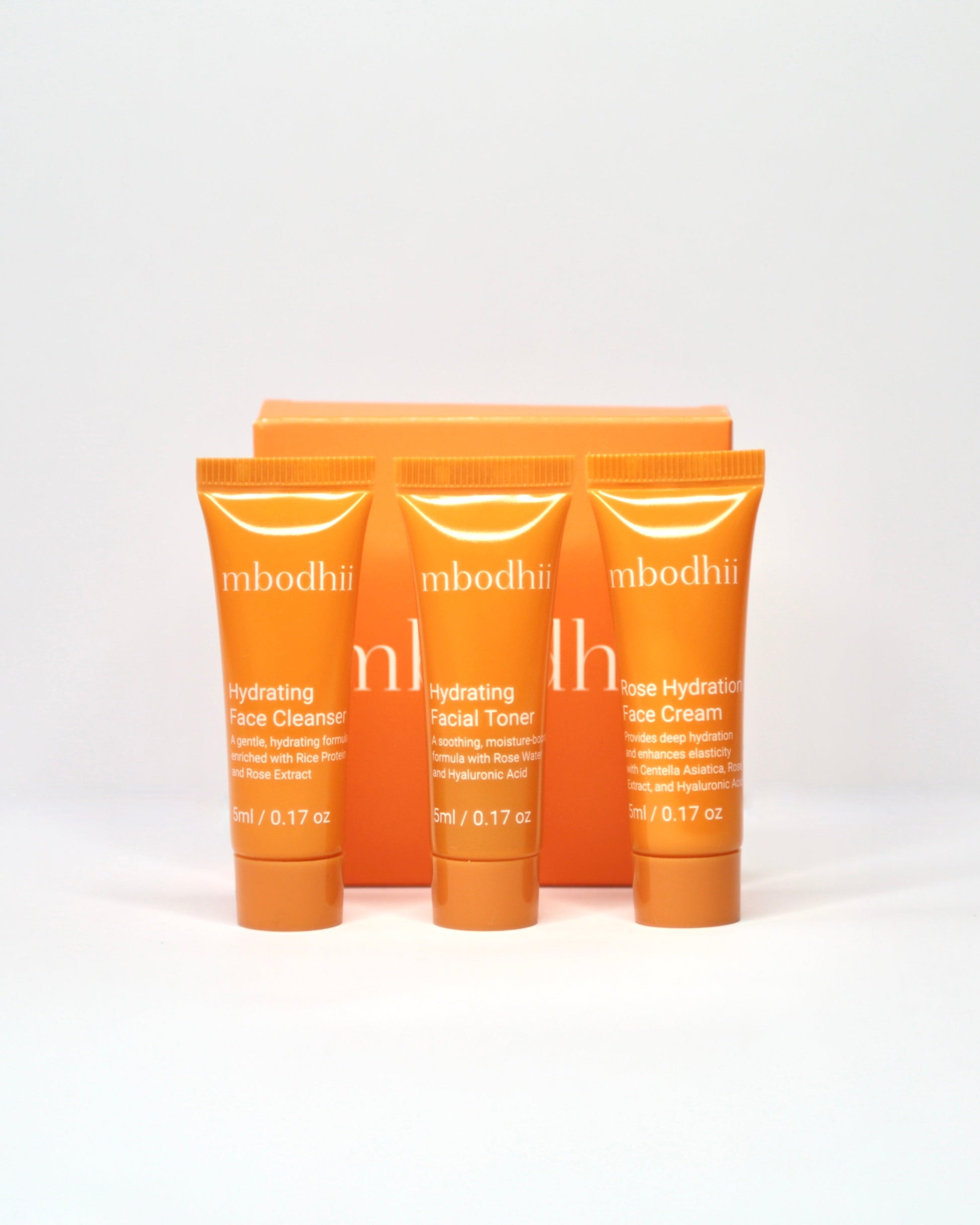 The mbodhii mini skincare sample pack of 3 x 5ml tubes of the Hydrating Face Cleanser + Hydrating Facial Toner + Rose Hydration Face Cream on a white background