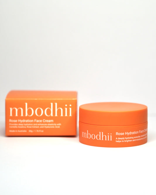 Orange mbodhii Rose Hydration Face Cream jar and box on a white background